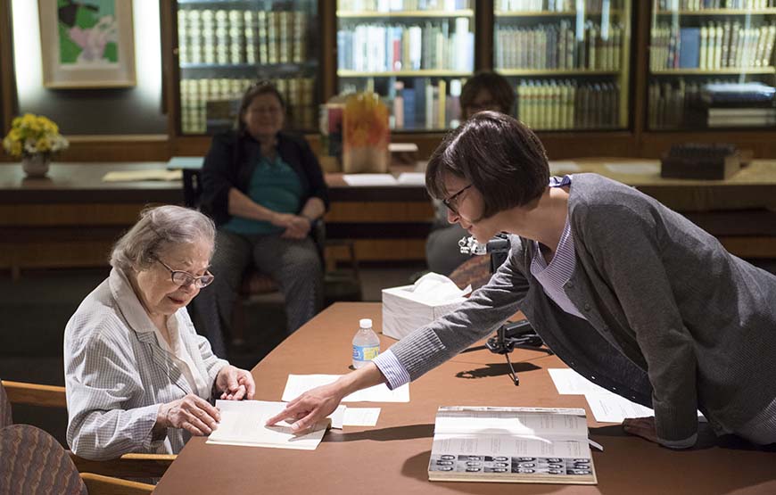 Anita Newell and Kate Barbera viewing archival materials