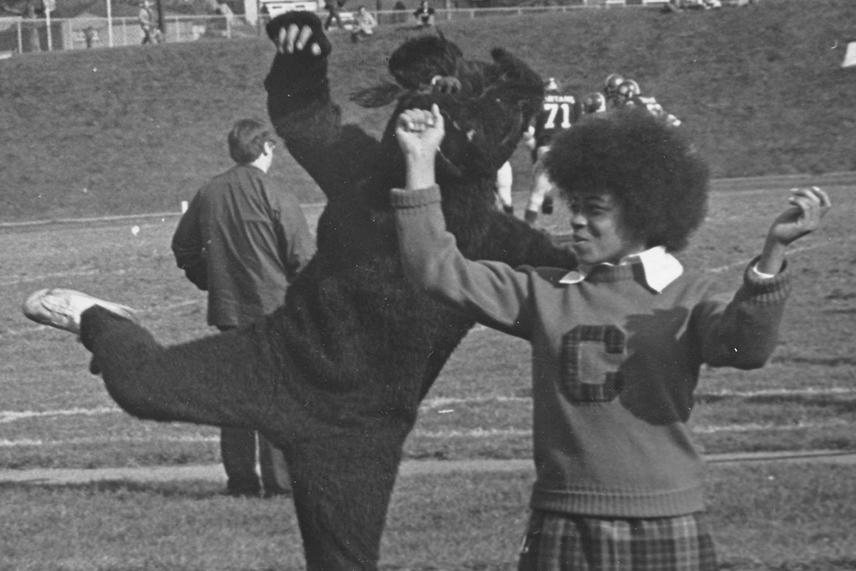 A SPIRIT club member cheerleader appears with Carnegie Mellon University's Scotty mascot on the athletic field. (c.1975) Found in the University Archives, available online via our Digital Collections.