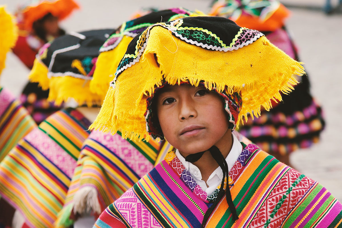 Image of boy in traditional Peruvian clothing.