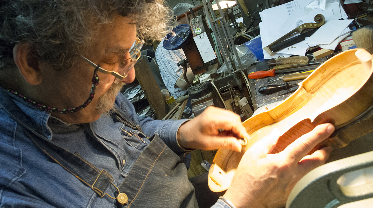 Violin maker and founder of Violins of Hope Amnon Weinstein in his workshop.