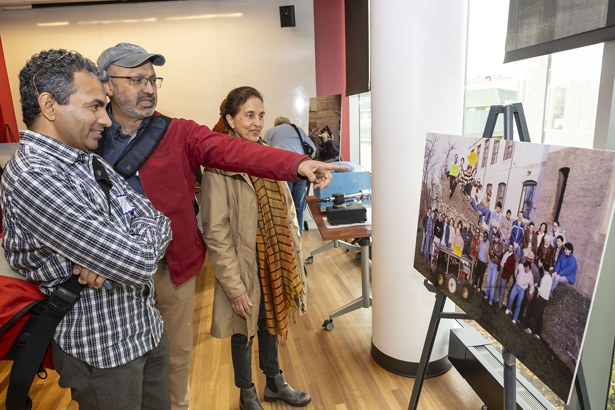Attendees, including alums Murali Krishna and Sanjiv Singh, pictured here, were able to look back on their time with the Field Robotics Center and help archivists identify people and projects in photographs.