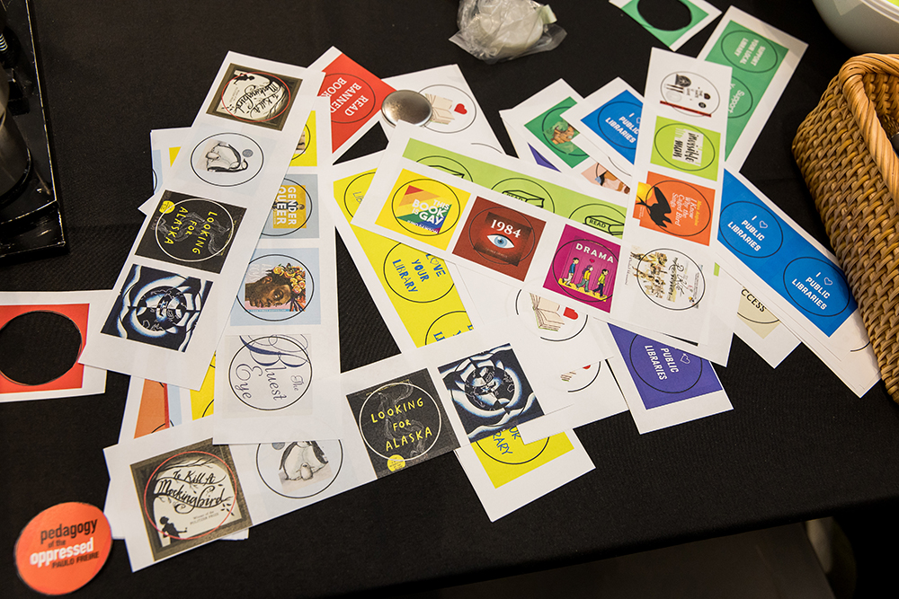Button designs included the covers of popular banned books, supportive messages about libraries, and other colorful designs.