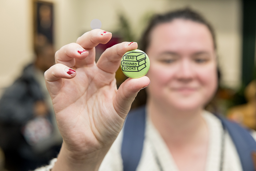 Postdoctoral Associate for Evidence Synthesis Erin Higgins shows off her button.