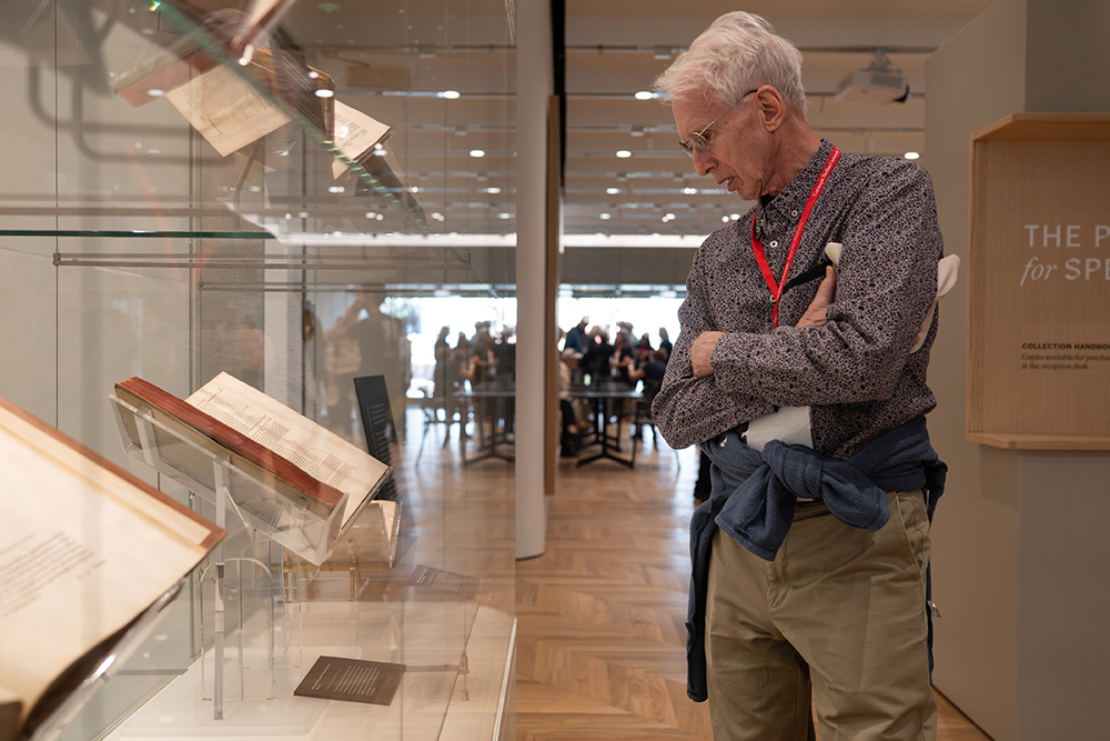 1966 Mellon College of Science graduate Lawrence Sulak stops to view Hasan Ibn al-Haytham’s “Book of Optics.”