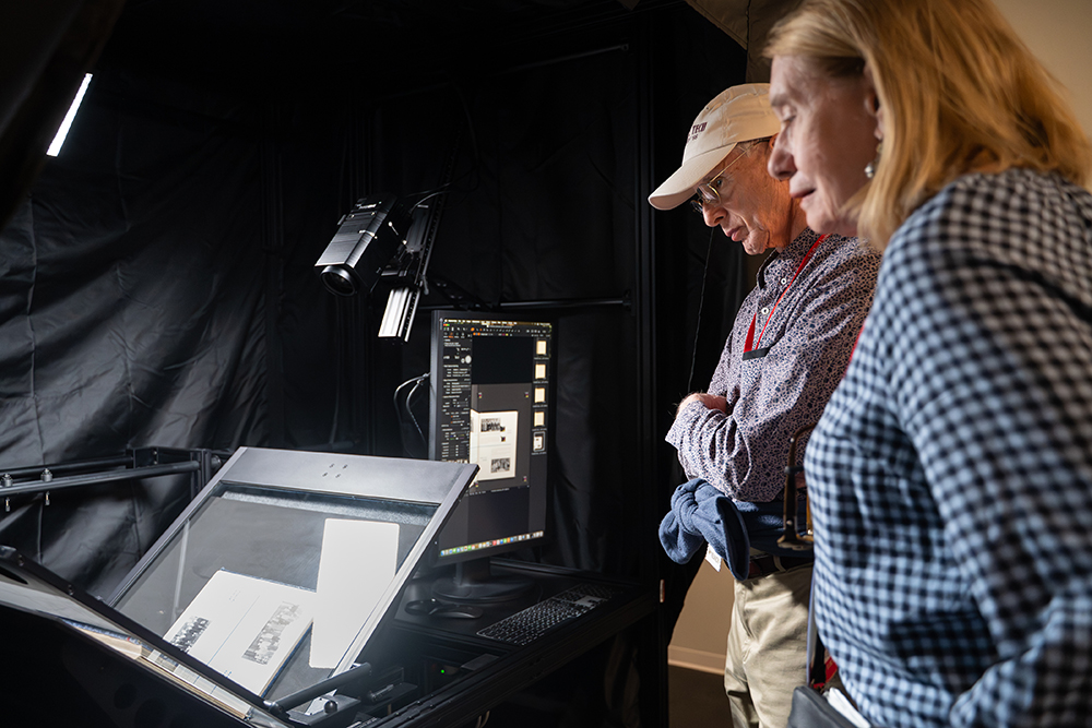 Attendees admire the Digitization Lab’s new DT BC100, a rare and powerful book capture system designed specifically for fragile materials.