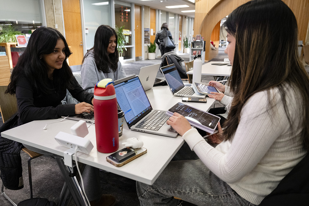 CMU students at laptops in Sorrells Library