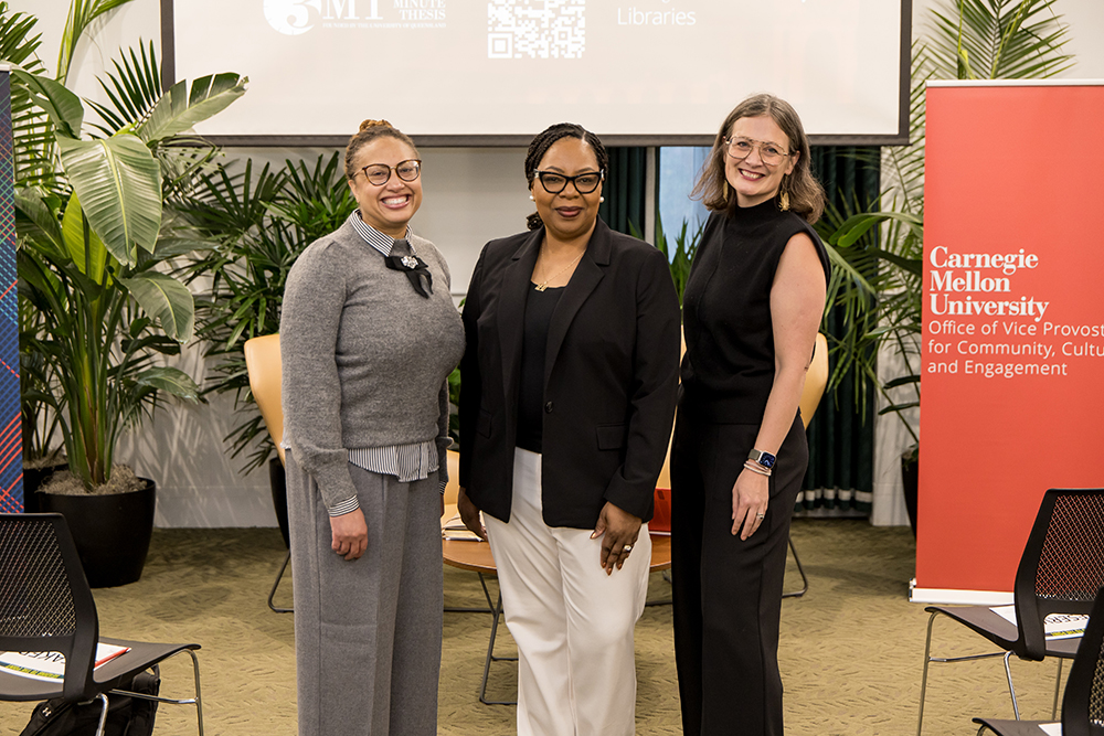 Rogers, Heading-Grant, and Agate pose together at the front of the room for the first fully in-person “Heading to the Point” event.