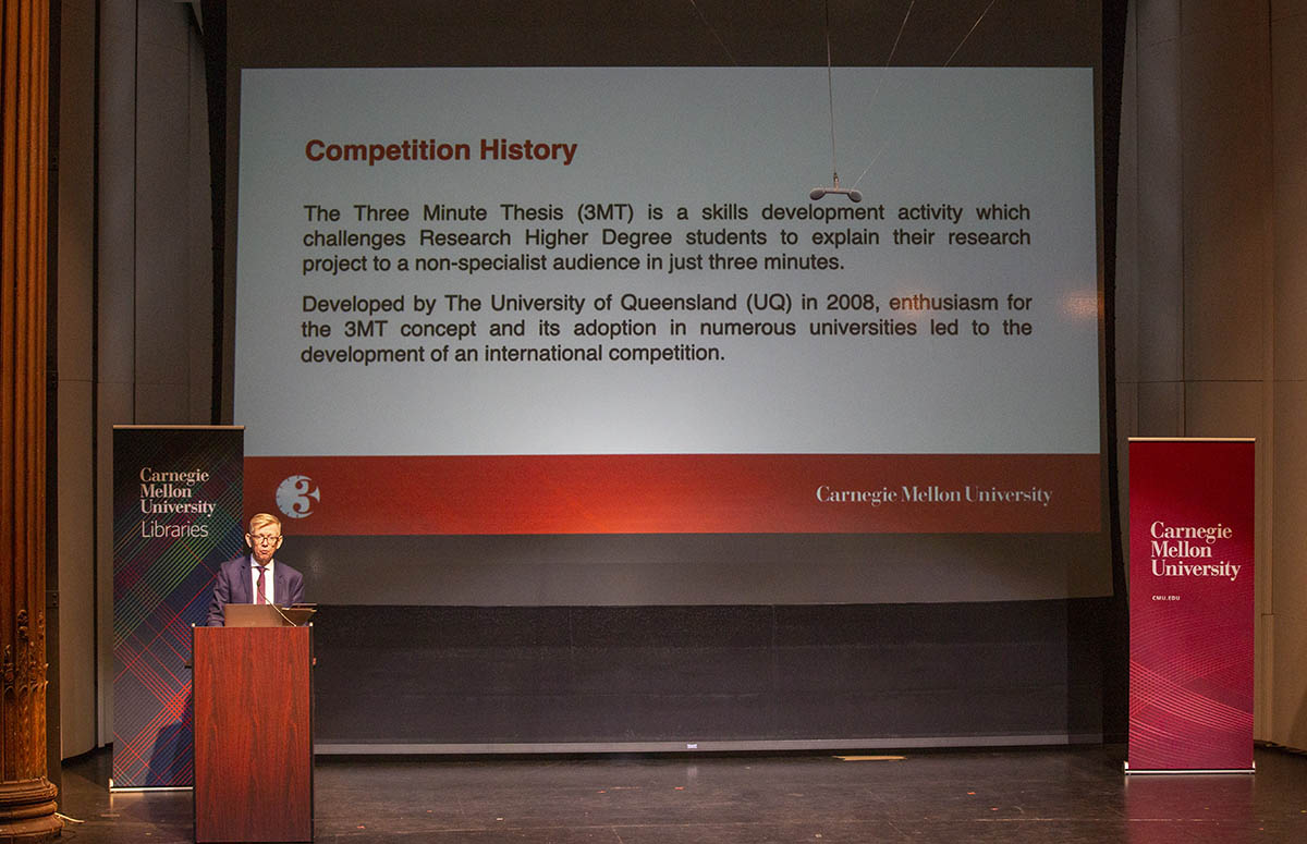 Webster outlines 3MT competition history at the 2023 championship.