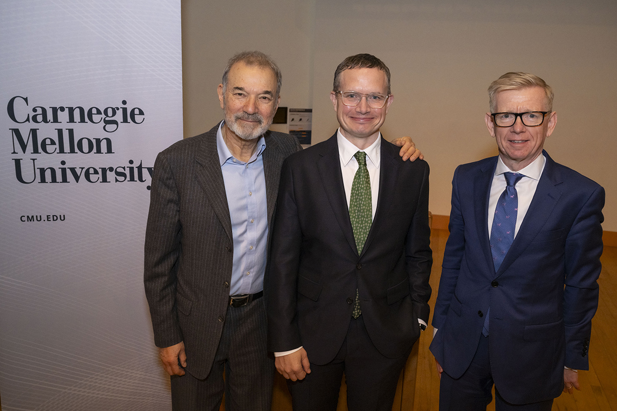 Stephen Greenblatt, Stephen Wittek and Keith Webster pose in front of the auditorium entrance.