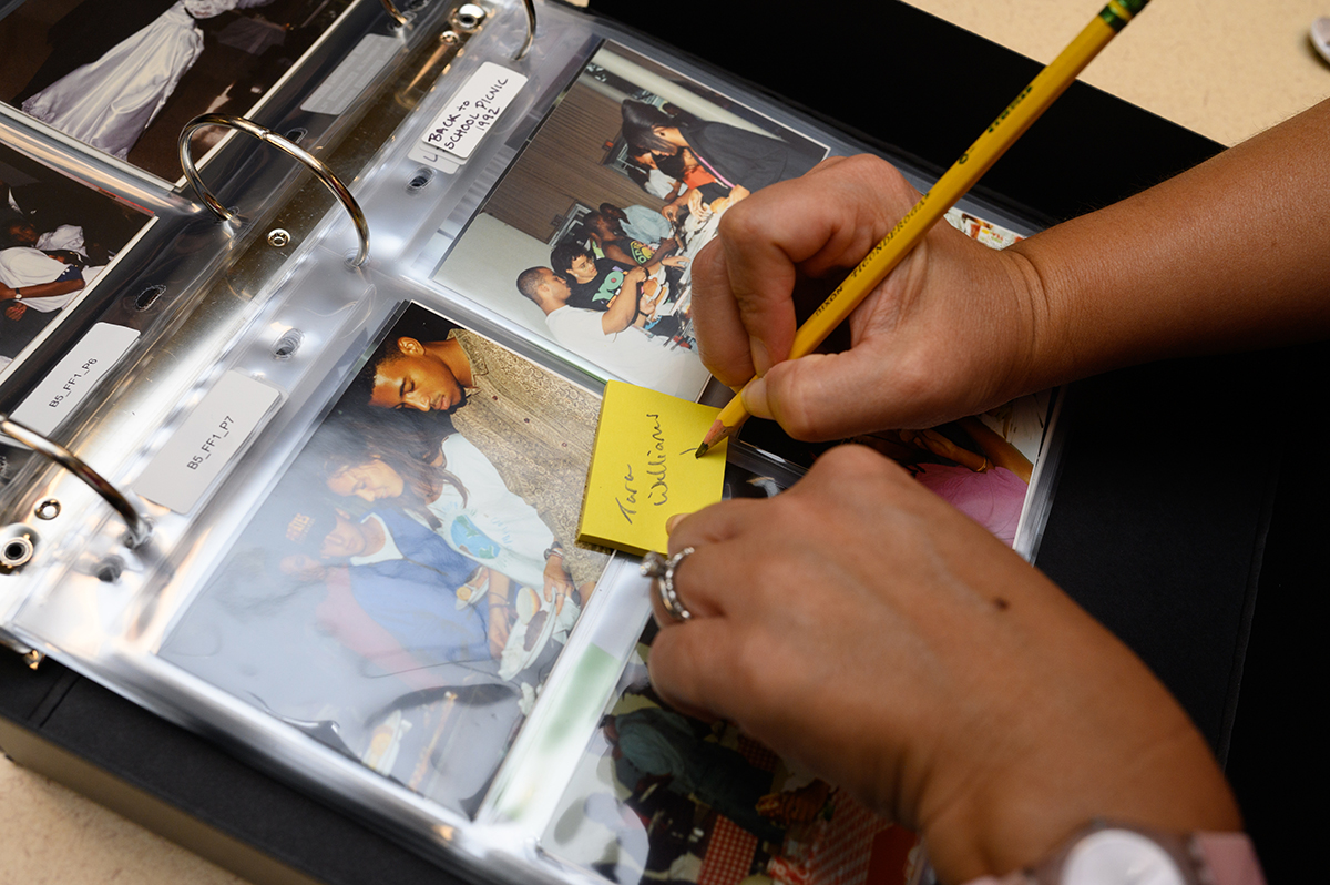 Post-it Notes and pencils were available for attendees to identify classmates in photo albums.