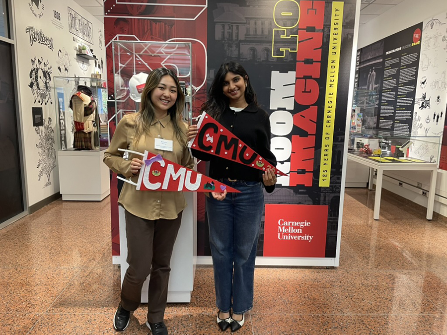 Students showing off their work from the “Hands On: Pizza & Pennant Making” kickoff event