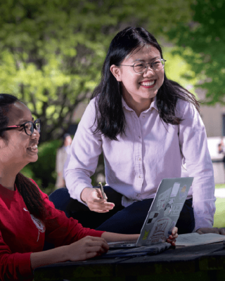 students with laptop